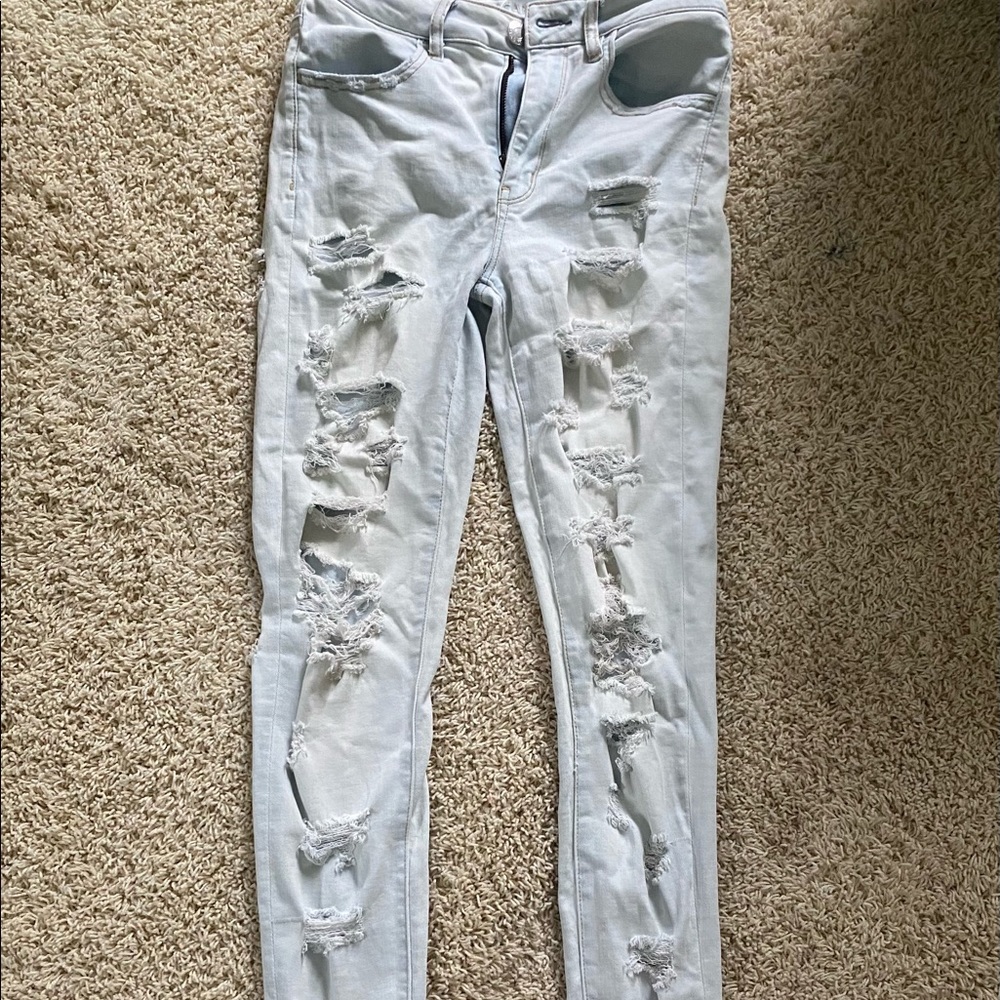American eagle size 6 reg dark wash ultra distressed jeans; stretchy